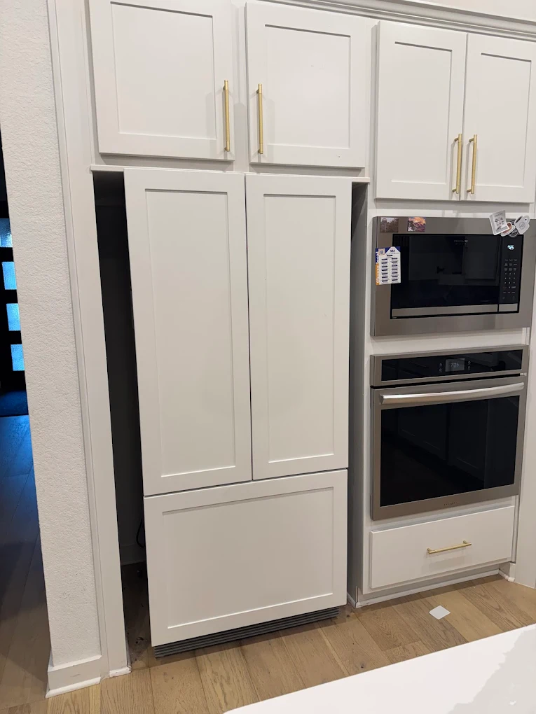 America's Appliance Repair technician working on a refrigerator in Leander, TX